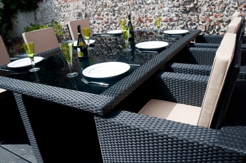 Alfresco dinning with black rattan furniture and table setting