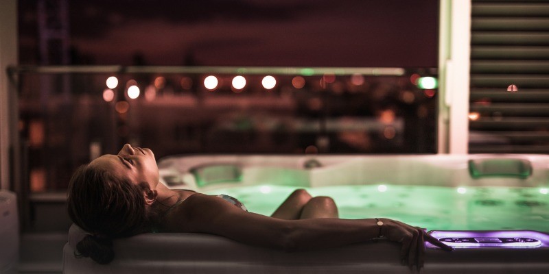 woman in hot tub at night