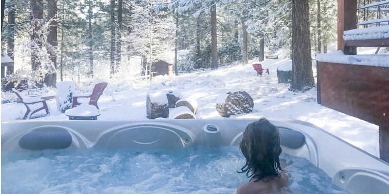 woman in hot tub during winter