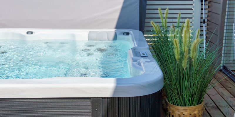 Close up of hot tub in sun - Are New Hot Tubs More Energy-Efficient?