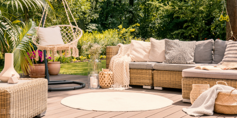 Patio seating area with swing & accessories - Must-have Patio Accessories for 2023: Your Ultimate Guide